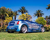 AUT 39 RK0313 02
2004 Alpine Mini Cooper Custom Paint Low 3/4 Rear View On Grass By Trees