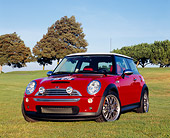 AUT 39 RK0316 01
2004 Mini Cooper S Red And White 3/4 Front View On Grass Trees Background
