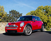 AUT 39 RK0319 03
2004 Mini Cooper S Red And White Low 3/4 Front View On Pavement Hill Trees Background