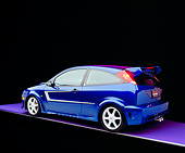 AUT 39 RK0334 08
2004 Ford Saleen N20 Focus Blue 3/4 Rear View On Purple Floor Gray Line Studio