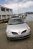 AUT 39 RK0353 01
2004 Nissan Primera Silver Wagon 3/4 Front View On Pavement By Harbor
