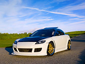 AUT 39 RK0359 01
2004 Mazda RX-8 White Black Top Low 3/4 Front View On Grass