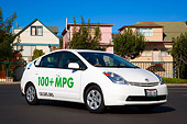 AUT 39 RK0363 01
2004 Toyota Prius Plug-In Hybrid White 3/4 Front View On Pavement By Houses Trees Blue Sky