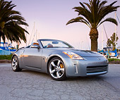 AUT 39 RK0381 01
2004 Nissan 350Z Silver 3/4 Front View By Marina Palm Trees Blue Sky
