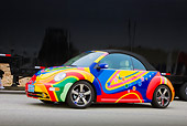 AUT 39 RK0387 01
2004 Volkwagen New Beetle Turbo Psychedelic 3/4 Front View On Pavement By Trailer