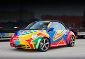 AUT 39 RK0388 01
2004 Volkwagen New Beetle Turbo Psychedelic 3/4 Front View On Pavement By Trailer