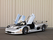 AUT 39 RK0400 01
2004 Mosler MT900S Silver Doors Open 3/4 Front View On Pavement