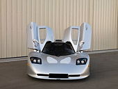 AUT 39 RK0402 01
2004 Mosler MT900S Silver Doors Open Front View On Pavement