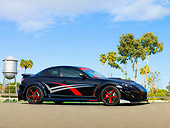 AUT 39 RK0405 01
2004 Mazda RX-8 Custom Black 3/4 Front View On Pavement By Trees Blue Sky