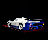 AUT 40 RK0195 14
2005 Maserati MC12 Pearl White And Blue 3/4 Rear View On Red Floor Studio