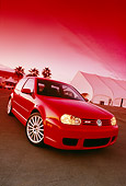 AUT 40 RK0002 02
2005 Volkswagen R32 Golf Red 3/4 Front View On Pavement By Building Palm Trees