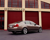 AUT 40 RK0050 01
2005 Infiniti M45 Pewter Rear 3/4 View On Pavement By Garage Doors