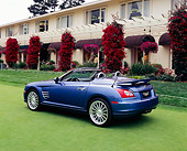 AUT 40 RK0054 01
2005 Chrysler Crossfire SRT-6 Convertible Blue 3/4 Rear View On Grass By Building