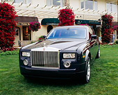 AUT 40 RK0055 05
2005 Rolls-Royce Centenary Edition Phantom Blue 3/4 Front View On Grass By Building
