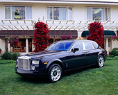 AUT 40 RK0055 09
2005 Rolls-Royce Centenary Edition Phantom Blue 3/4 Front View On Grass By Building