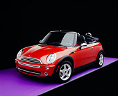 AUT 40 RK0078 01
2005 Mini Cooper Convertible Orange 3/4 Front View On Purple Floor Studio
