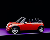 AUT 40 RK0080 02
2005 Mini Cooper Convertible Orange 3/4 Side View On Purple Floor Studio