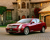 AUT 40 RK0143 02
2005 Cadillac STS Red 3/4 Front View On Driveway By House