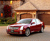 AUT 40 RK0147 05
2005 Cadillac STS Red 3/4 Front View On Driveway By House