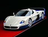 AUT 40 RK0196 10
2005 Maserati MC12 Pearl White And Blue 3/4 Front View On Red Floor Studio
