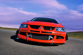 AUT 40 RK0259 01
2005 Mitsubishi Lancer Evolution VIII Red Low Head On View On Pavement
