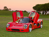 AUT 40 RK0278 01
2005 Ultima GTR Red 3/4 Front View Doors Open On Grass By Trees Sky