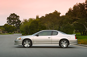 AUT 41 RK0127 01
2006 Chevrolet Monte Carlo SS Silver Profile Shot On Pavement By Trees