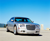 AUT 41 RK0036 01
2006 Chrysler 300 SRT8 Silver 3/4 Front View On Pavement Blue Sky