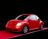 AUT 41 RK0079 02
2006 Volkswagen New Beetle Red 3/4 Front View On Red Floor Studio