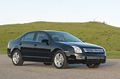 AUT 41 RK0110 01
2006 Ford Fusion Black 3/4 Front View On Pavement Grass Hills
