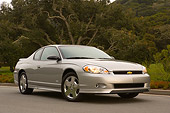 AUT 41 RK0125 01
2006 Chevrolet Monte Carlo SS Silver Low 3/4 Front View On Pavement By Trees
