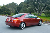 AUT 41 RK0129 01
2006 Honda Civic Si Red 3/4 Rear View On Pavement By Trees