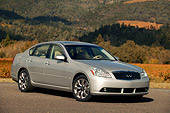 AUT 41 RK0191 01
2006 Infiniti M35 Silver 3/4 Front View On Pavement By Hills And Trees