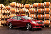AUT 41 RK0196 01
2006 Infiniti M45 Red 3/4 Side View On Pavement By Barrels