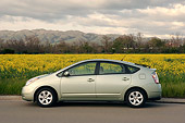 AUT 41 RK0204 01
2006 Toyota Prius Hybrid Light Green Profile View On Pavement Field