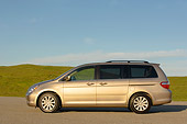 AUT 41 RK0256 01
2006 Honda Odyssey Touring Desert Rock Mist Profile View On Pavement By Grass Hills