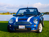 AUT 41 RK0360 01
2006 Mini Cooper S Convertible Blue JCW Tuning Front 3/4 View On Grass