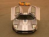 AUT 41 RK0411 01
2006 Ford GTB Gray And Silver Head On 2006 GTX1 Yellow And Silver 3/4 Side View On Pavement