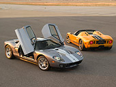 AUT 41 RK0427 01
2006 Ford GTB Gray Silver Stripe 3/4 Front 2006 GTX1 Yellow Silver Stripe 3/4 Rear View On Pavement