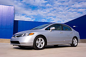 AUT 41 RK0445 01
2006 Honda Civic EX Silver Low 3/4 Side View On Pavement By Building
