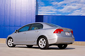 AUT 41 RK0448 01
2006 Honda Civic EX Silver Low 3/4 Rear View On Pavement By Building