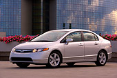 AUT 41 RK0460 01
2006 Honda Civic EX Silver Low 3/4 Side View On Pavement By Building And Trees
