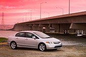AUT 41 RK0462 02
2006 Honda Civic EX Silver 3/4 Side View On Pavement By Bridge