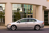 AUT 41 RK0463 01
2006 Honda Civic EX Silver Profile View On Pavement By Building