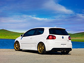 AUT 41 RK0532 01
2006 Volkswagen Thunder Bunny White 3/4 Rear View On Pavement By Water