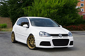 AUT 41 RK0534 01
2006 Volkswagen Thunder Bunny Golf White 3/4 Front View On Pavement By Trees