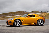 AUT 41 RK0543 01
2006 Pontiac Solstice Weekend Club Racer Gold 3/4 Front View On Pavement