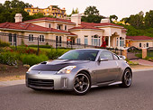 AUT 41 RK0569 01
2006 Nissan 350Z Silver 3/4 Front View On Pavement By House