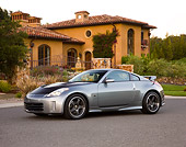 AUT 41 RK0572 01
2006 Nissan 350Z Silver 3/4 Front View On Pavement By House