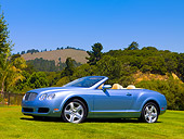 AUT 42 RK0076 01
2007 Bentley Continental GTC Convertible Light Blue 3/4 Side On Grass By Trees